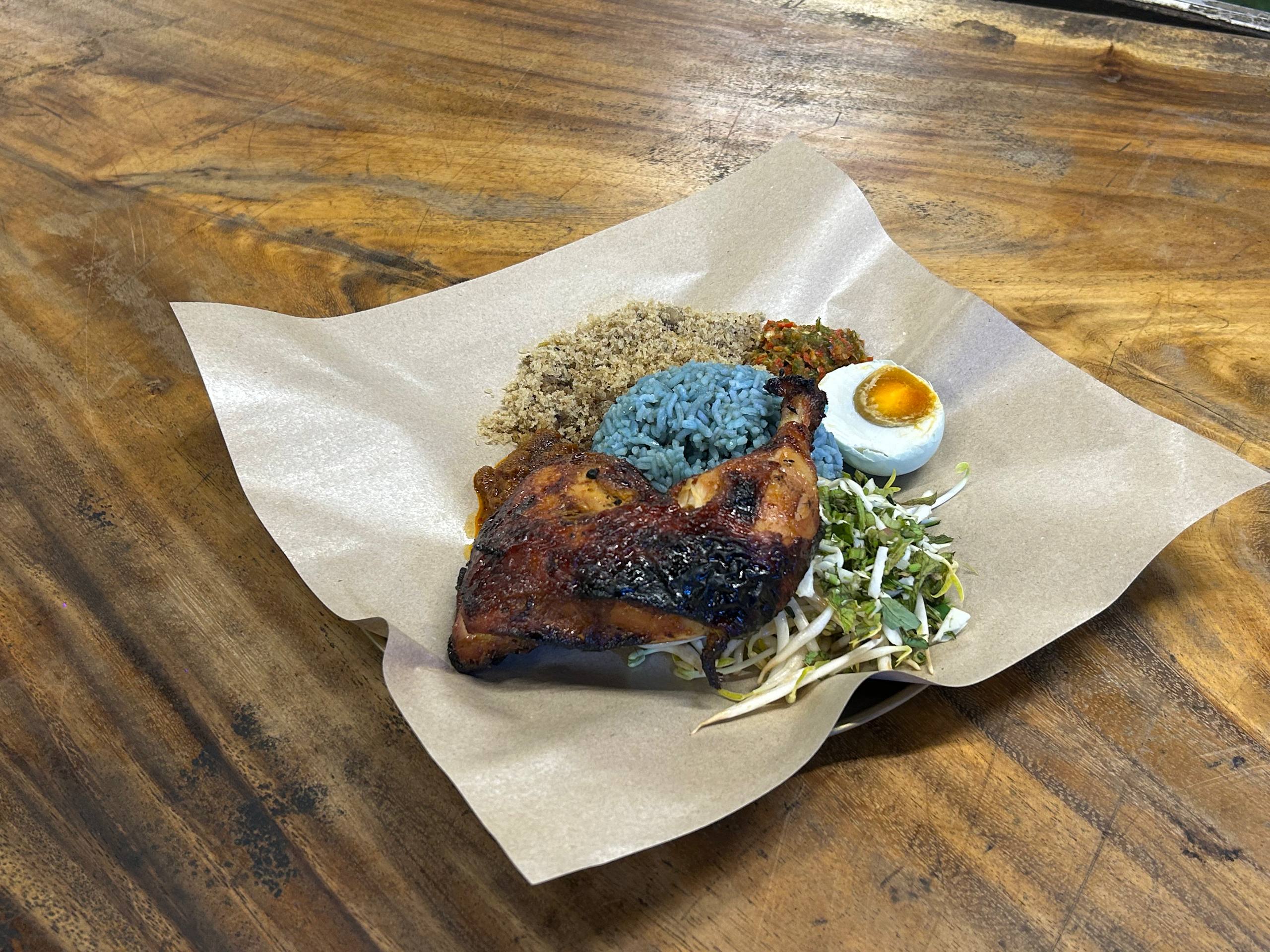 Nasi Kerabu with a grilled chicken whole leg at Araso